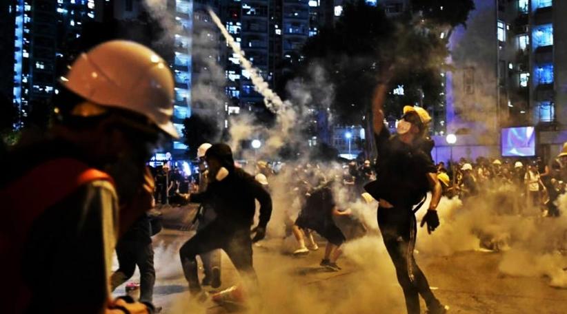 China warns Hong Kong protesters will be 'punished' and refuses to rule out military intervention