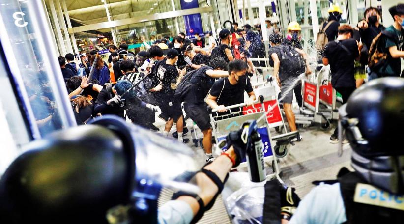 Chinese forces exercise across border as Hong Kong braces for protests