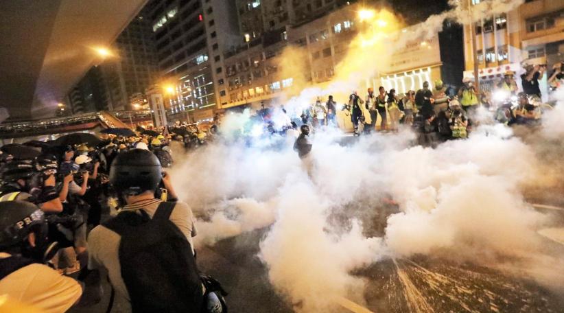 Hong Kong police fire tear gas as clashes erupt after thousands appeal to Trump