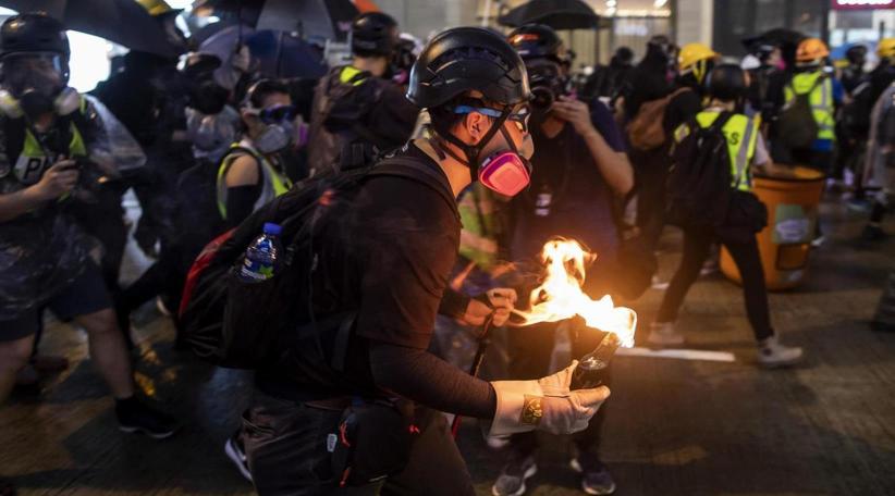 Hong Kong police fire tear gas, water cannon at petrol-bomb throwing protesters