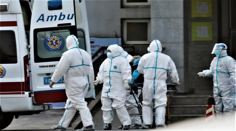 China says new virus can be spread by humans and fourth death confirmed