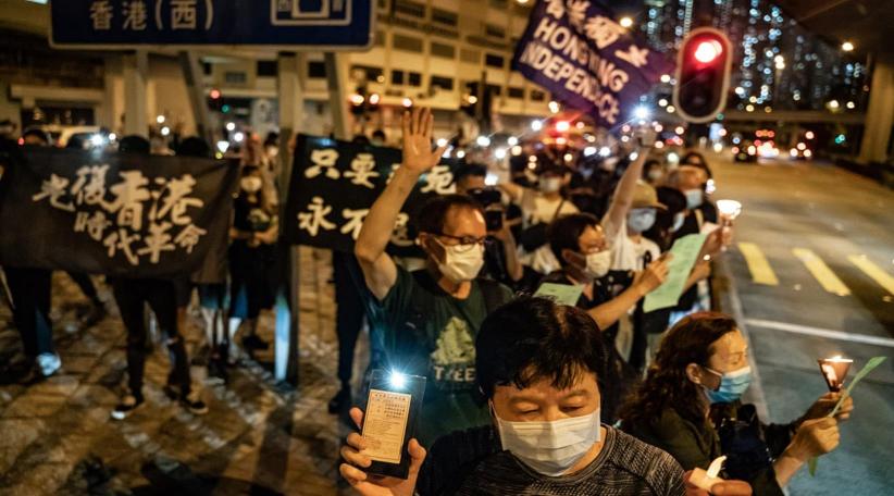 Hong Kong protesters hold banned Tiananmen vigil as anthem law is passed