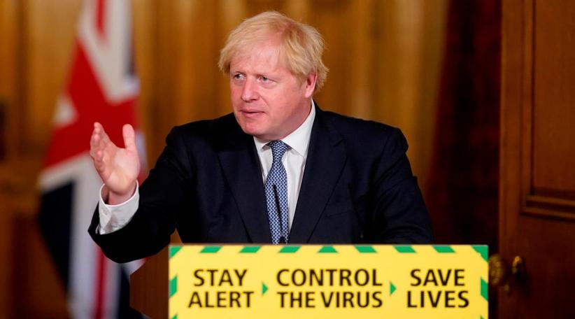 UK PM 'squeezes the brakes' and delays easing