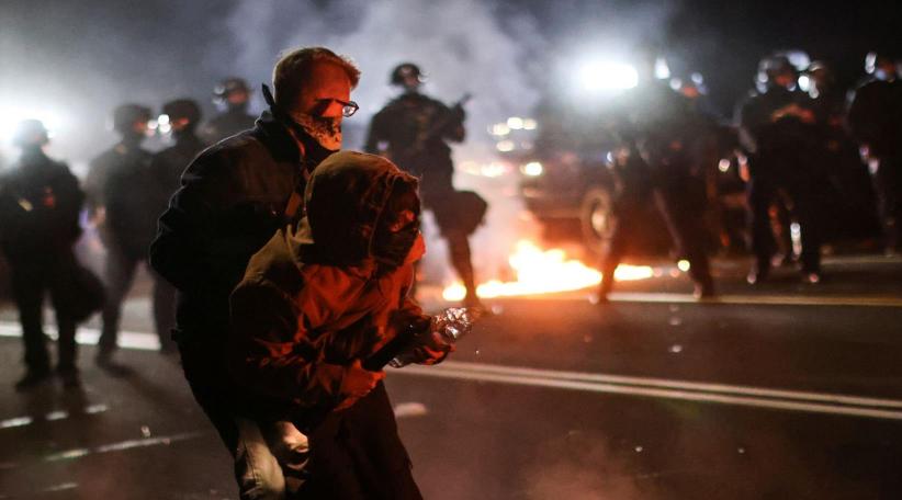 Police use tear gas, Portland protesters throw fire bombs