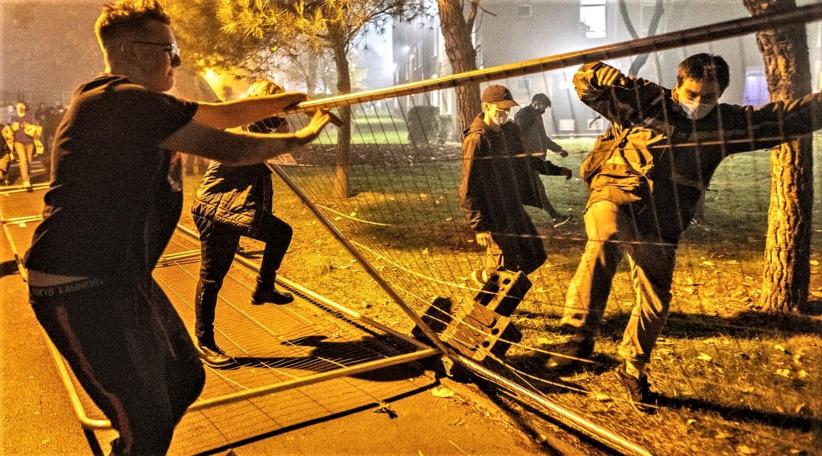 Manchester students pull down lockdown fences around halls of residence