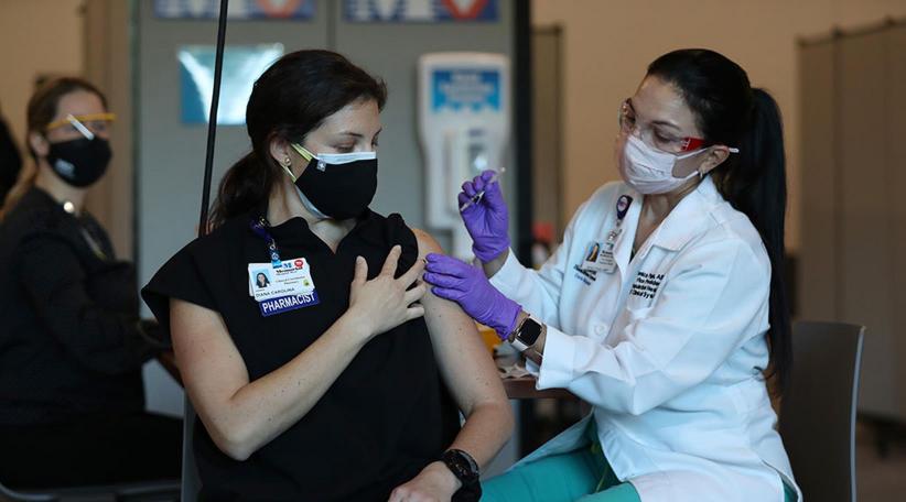 More than half of American adults vaccinated against COVID19