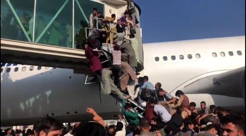 Chaotic scenes at Kabul airport as Afghans and foreign nationals flee Taliban