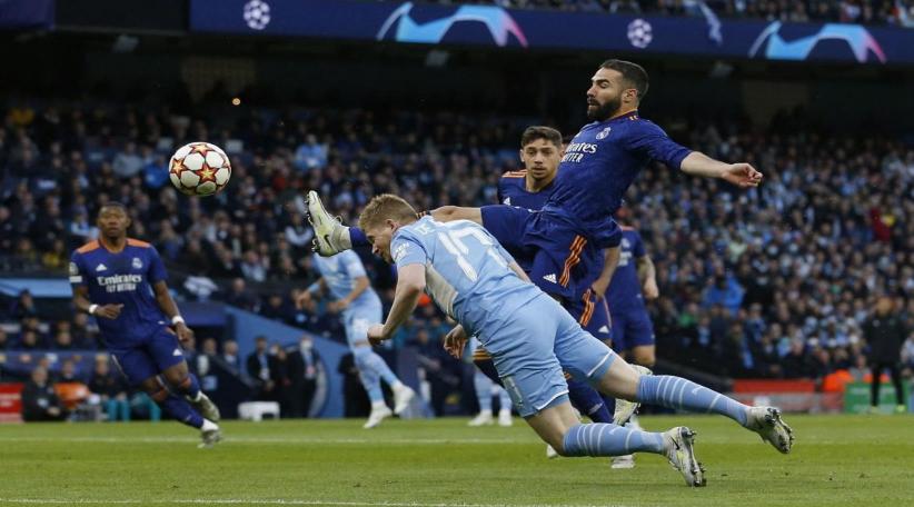 Manchester City edge Real Madrid in 4-3 thriller but Benzema keeps tie alive