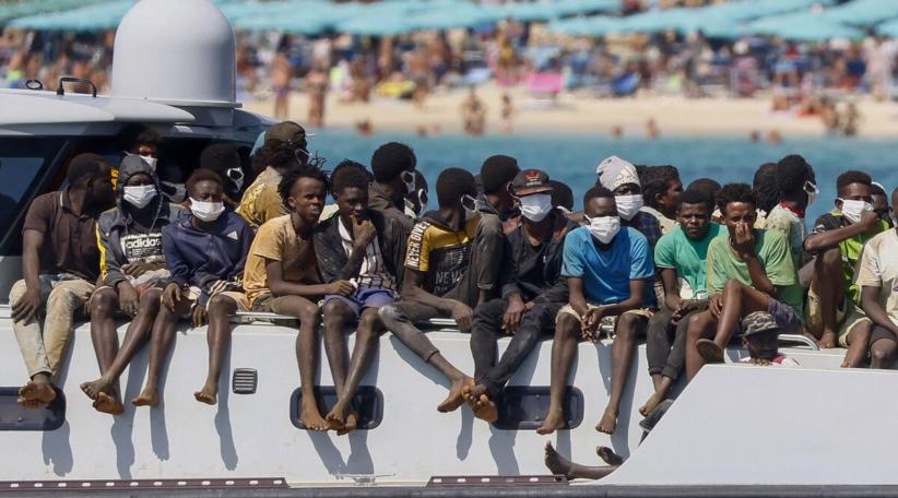 EU agrees new rules on hosting migrants, seeks to cut numbers