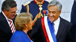 Sebastián Piñera receiving the presidential sash from the president of Chile’s Senate. The departing president, Michelle Bachelet looked on during the swearing-in ceremony on Sunday.