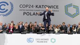 Nearly 200 countries overcame political divisions late on Saturday to agree on rules for implementing a landmark global climate deal
