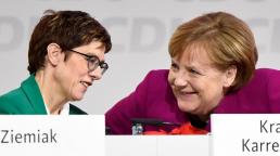 New CDU leader Annegret Kramp-Karrenbauer talks with former CDU chief and German Chancellor Angela Merkel during the Christian Democratic Union (CDU) party congress in Hamburg, Germany, December 8, 2018. REUTERS/Fabian Bimmer