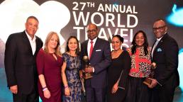 Jamaica's Minister of Tourism, Edmund Bartlett (centre) flanked by senior executives from the Jamaica Tourist Board. From left to right: Donnie Dawson, Deputy Director of Tourism, Sales; Elizabeth Fox, Regional Director, UK/N Europe; Francine Carter-Henry, Manager, Tour Operators & Airlines; Camile Glenister, Deputy Director of Tourism, Marketing; Angella Bennett, Regional Director, Canada and Donovan White, Jamaica's Director of Tourism.