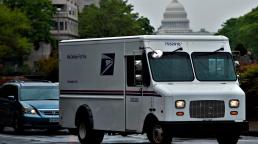 US Postal Service halts controversial changes amid voting furore
