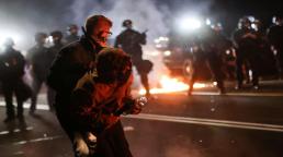Police use tear gas, Portland protesters throw fire bombs
