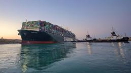 Suez Canal: Ships begin sailing through cleared waterway