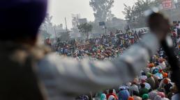 Indian farmers suspend year-long protest against new laws