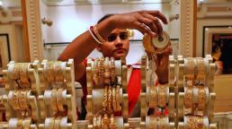 India raises import tax on gold to support rupee