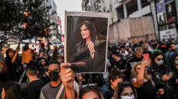 Iran's Revolutionary Guards issue warning as protests over woman's death spread