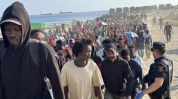 Cerca de 1.700 migrantes son trasladados de la playa a centros temporales de acogida en Ceuta.