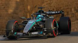 George Russell holds off Verstappen to win chaotic Azerbaijan Grand Prix.
